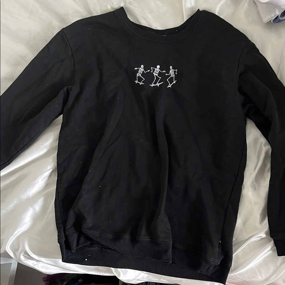 Black crew neck with skeletons skateboarding